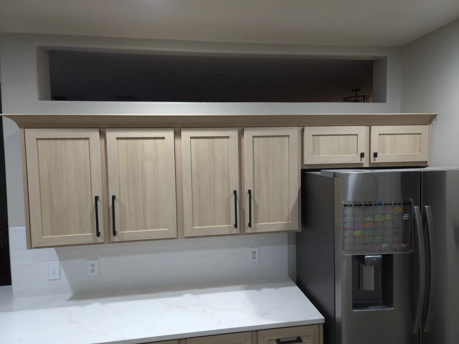 Light oak kitchen cabinets with quartz countertops - A2Z Solutions project